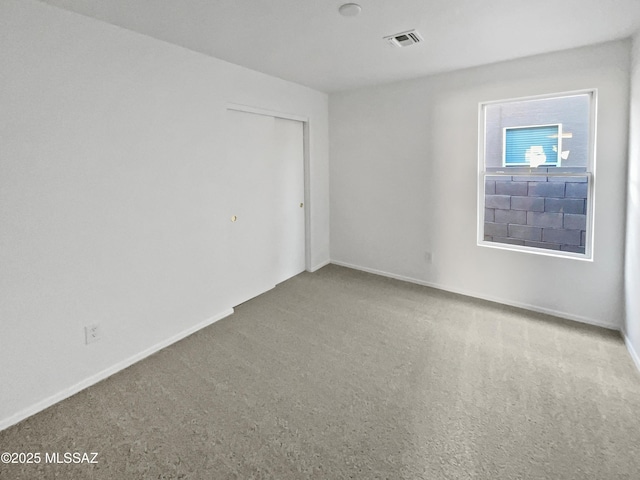 spare room featuring carpet