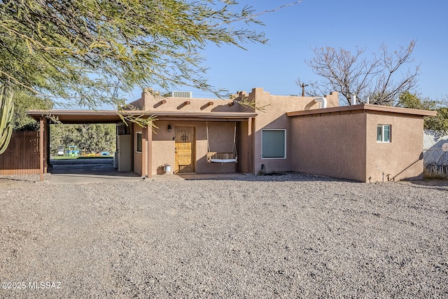 rear view of house with a carport