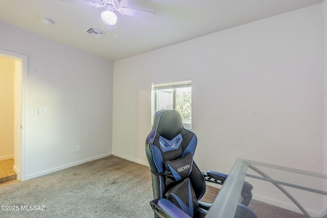 office space with ceiling fan and light colored carpet