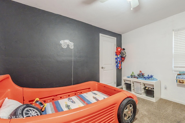 carpeted bedroom with ceiling fan