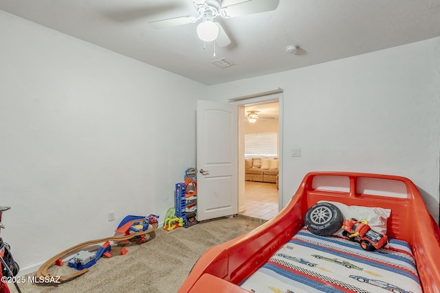 carpeted bedroom featuring ceiling fan