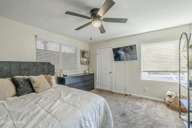 bedroom featuring ceiling fan and light carpet