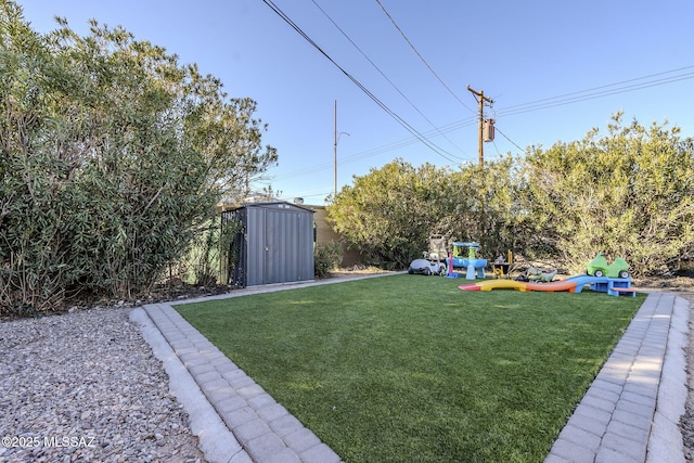 view of yard with a storage shed