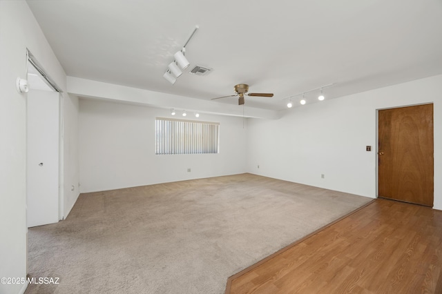 9256 E 26th St, Tucson, AZ 85710 - empty room featuring track lighting, ceiling fan, and carpet