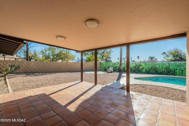 view of patio / terrace with a fenced in pool