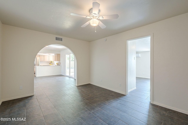 spare room with ceiling fan