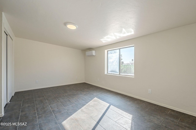 spare room with an AC wall unit