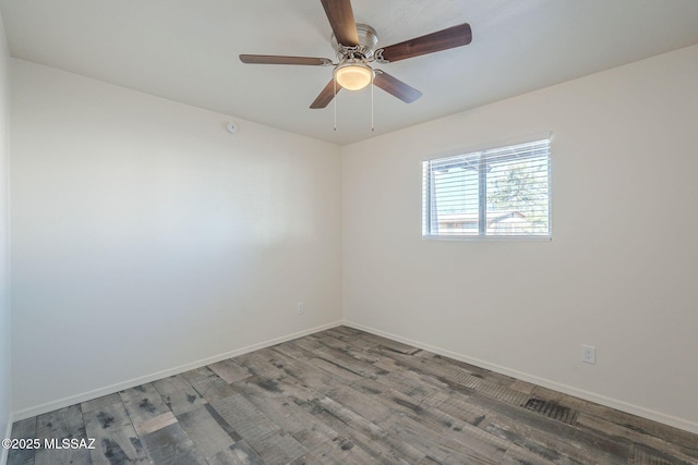 empty room featuring wood-type flooring and ceiling fan