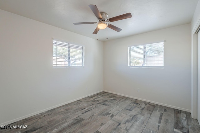 spare room featuring ceiling fan and hardwood / wood-style floors