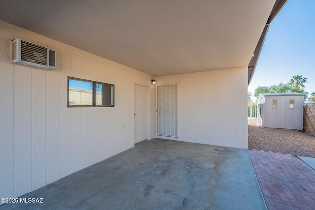 view of patio with a wall mounted AC