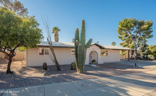 ranch-style house with a carport