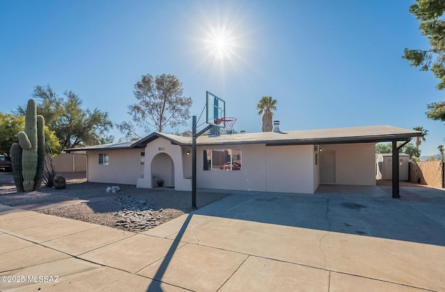 ranch-style house with a carport