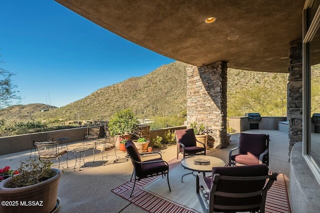 view of patio with a mountain view