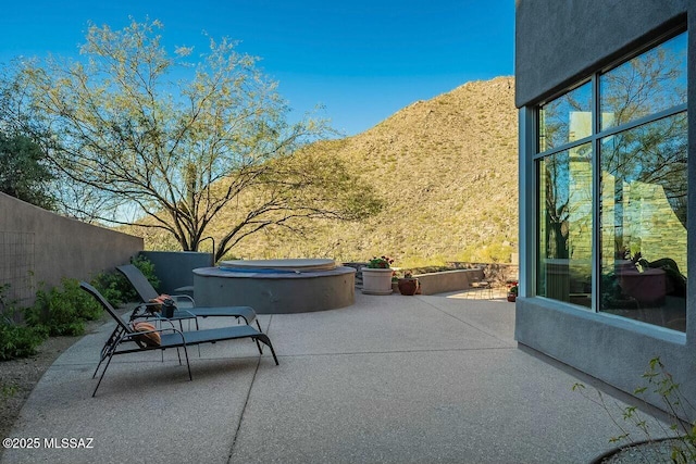 view of patio featuring a hot tub