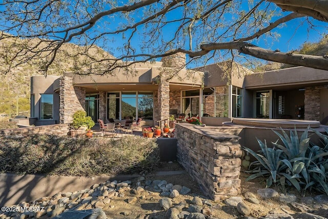 rear view of property with a patio