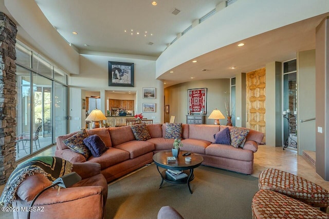 living room with a towering ceiling