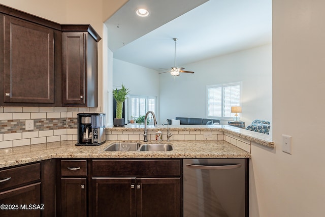 kitchen with dark brown cabinetry, backsplash, ceiling fan, dishwasher, and a sink