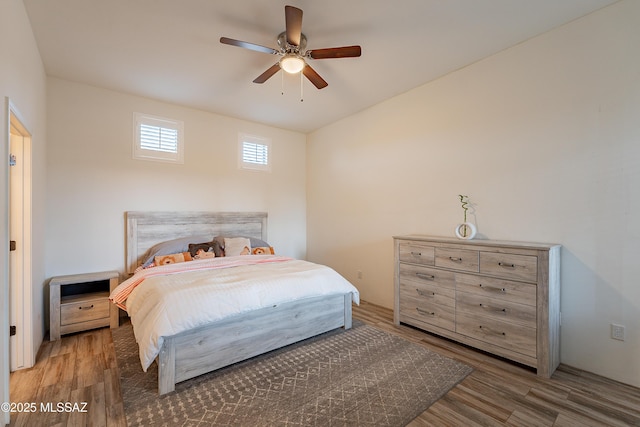 bedroom featuring dark wood-type flooring and ceiling fan