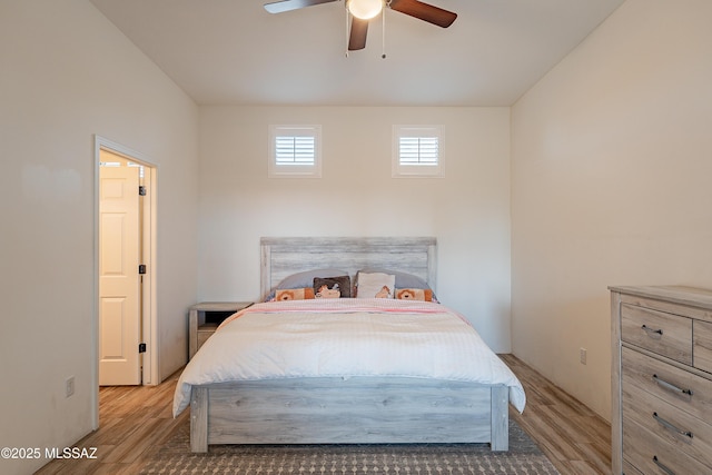 bedroom featuring a ceiling fan and light wood finished floors