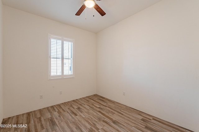 unfurnished room featuring ceiling fan and light wood-type flooring