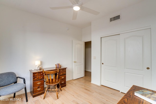 office with ceiling fan and light wood-type flooring