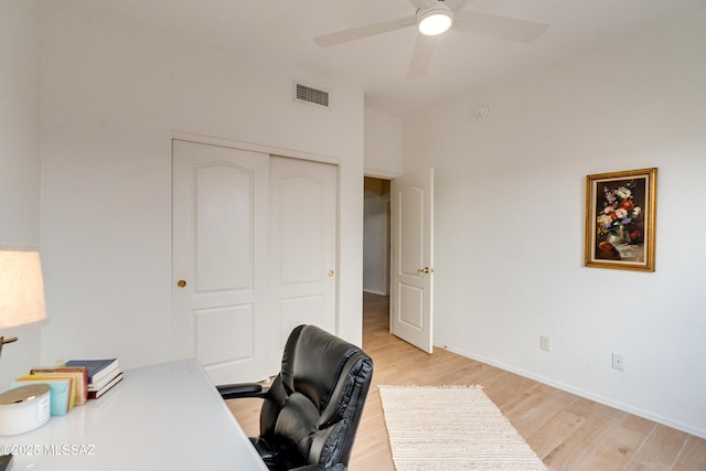 home office featuring ceiling fan and light hardwood / wood-style floors