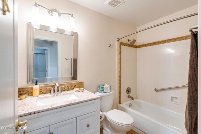 full bathroom featuring vanity, toilet, and bathtub / shower combination