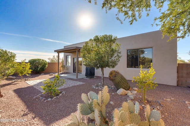 rear view of house with a patio area