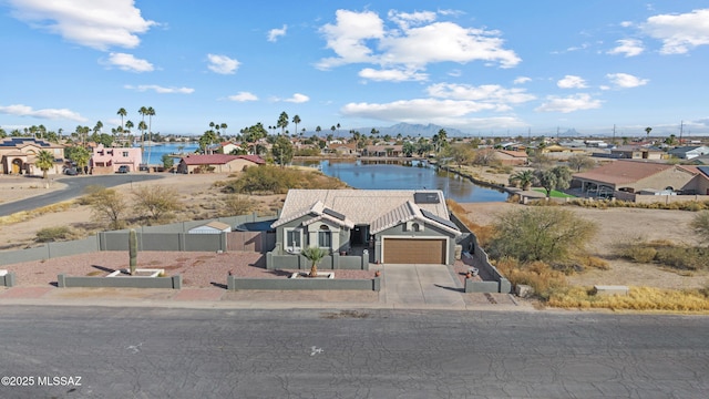 birds eye view of property featuring a water view