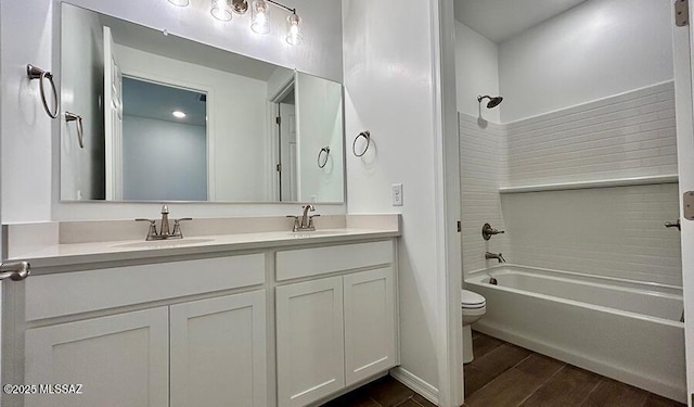 full bathroom with shower / bathing tub combination, a sink, double vanity, and toilet