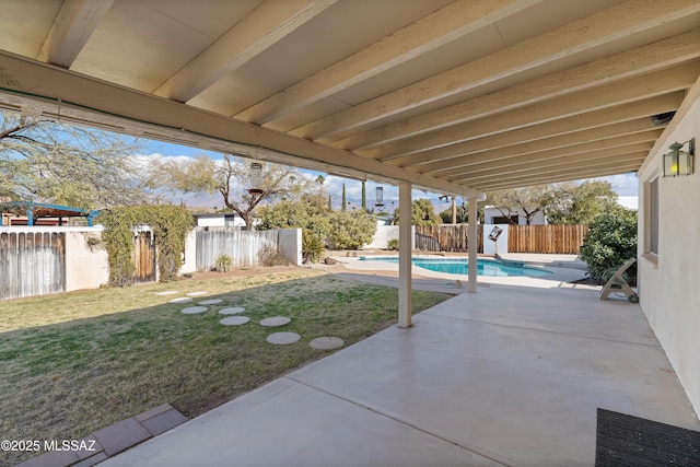 view of patio / terrace featuring a fenced in pool