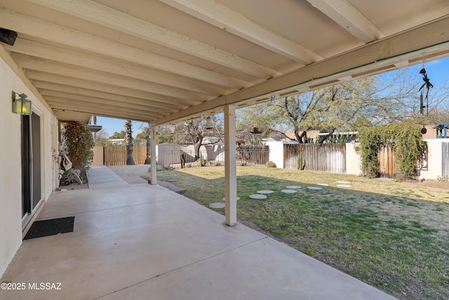 view of patio featuring a storage shed