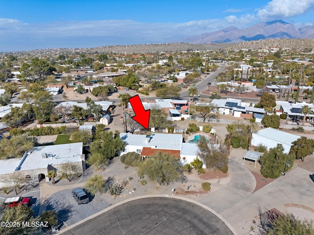 drone / aerial view featuring a mountain view