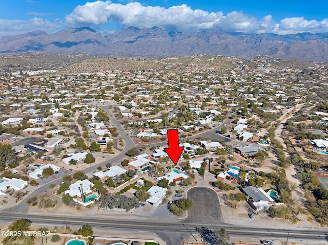 birds eye view of property with a mountain view