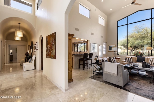 interior space with a wealth of natural light and a high ceiling