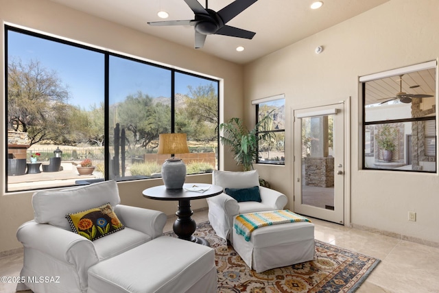 living area featuring ceiling fan