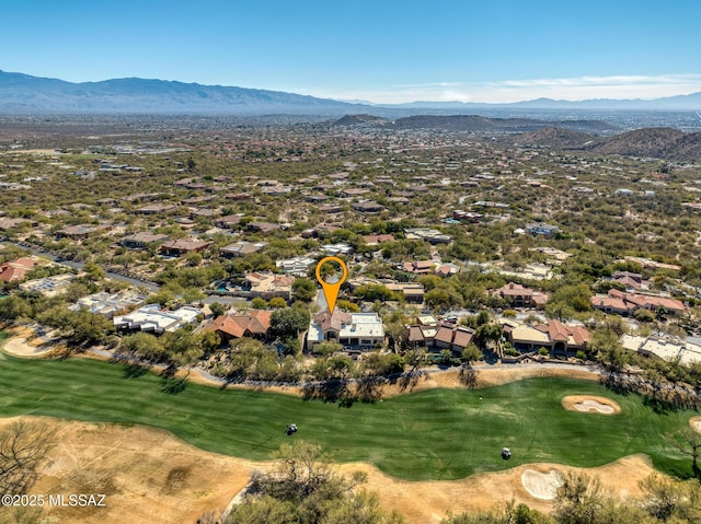 birds eye view of property with a mountain view