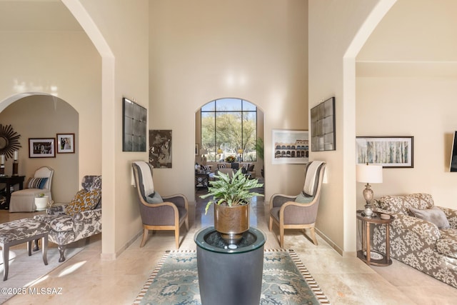 living area with a high ceiling