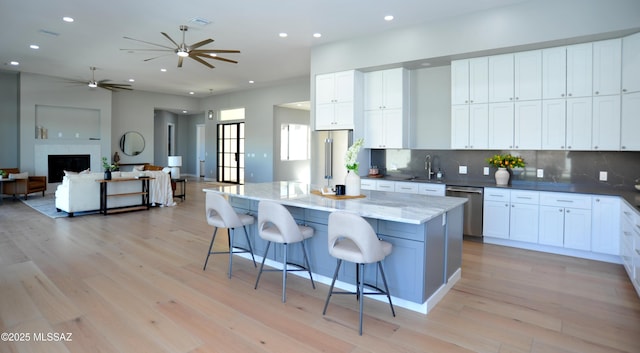 kitchen featuring a center island, white cabinetry, and stainless steel appliances