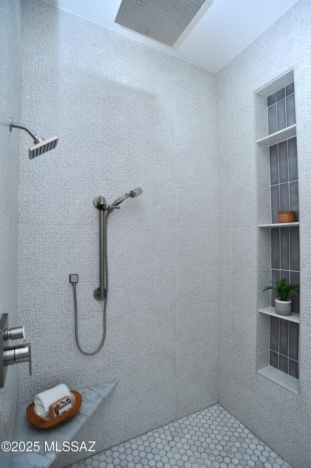 bathroom with a tile shower