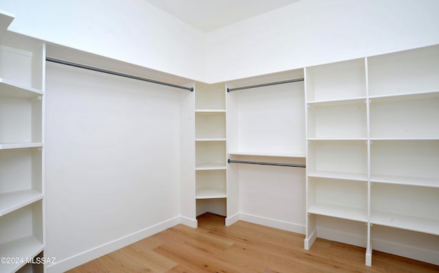 spacious closet featuring hardwood / wood-style floors