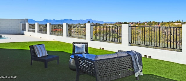 view of patio / terrace featuring a mountain view