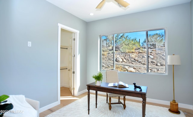 office space with ceiling fan and light wood-type flooring