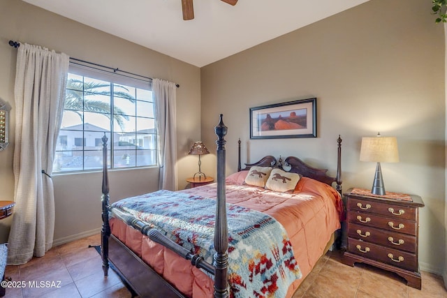 bedroom featuring ceiling fan, baseboards, and light tile patterned floors