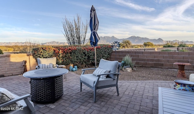 view of patio / terrace featuring a fenced backyard and a mountain view