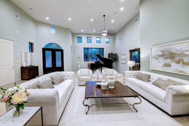 living room with a high ceiling