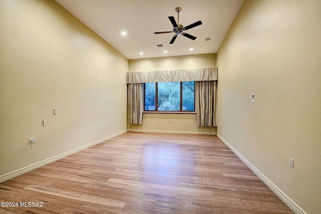 spare room with ceiling fan and light hardwood / wood-style flooring