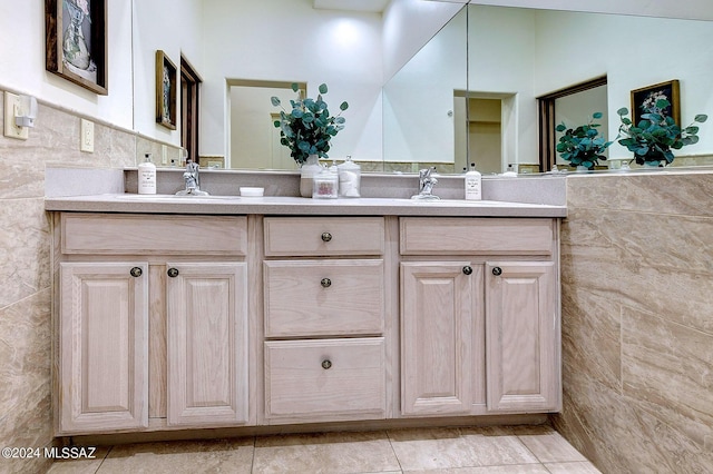 bathroom featuring vanity, tile patterned flooring, and tile walls