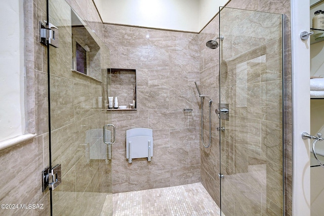 bathroom with a shower with shower door