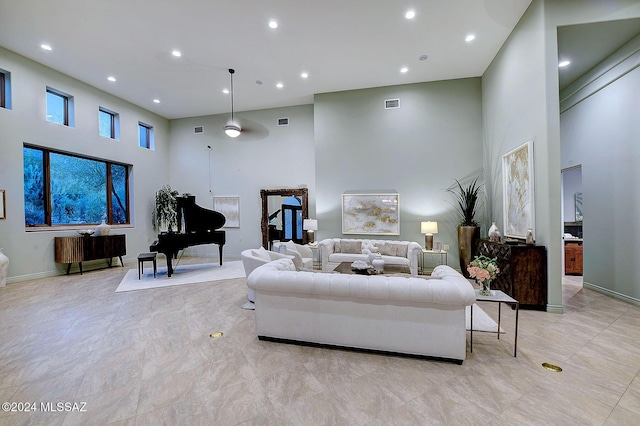 living room with a high ceiling